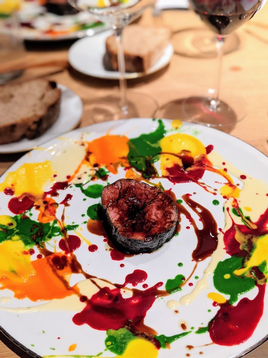 Beautiful psychedelic spin painted veal, charcoal grilled with glorious colors as a painting