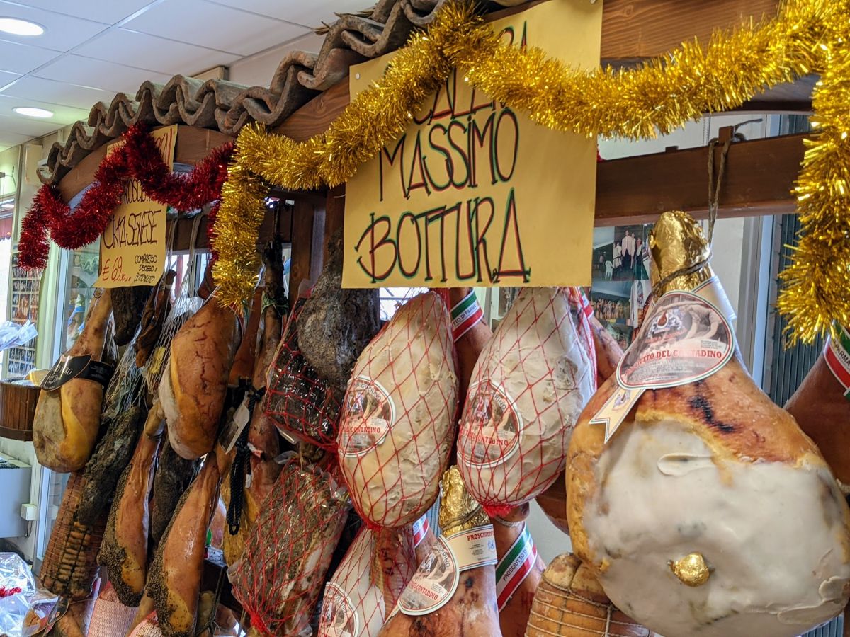 Sign advertising the prosciutto supplied to Massimo Bottura