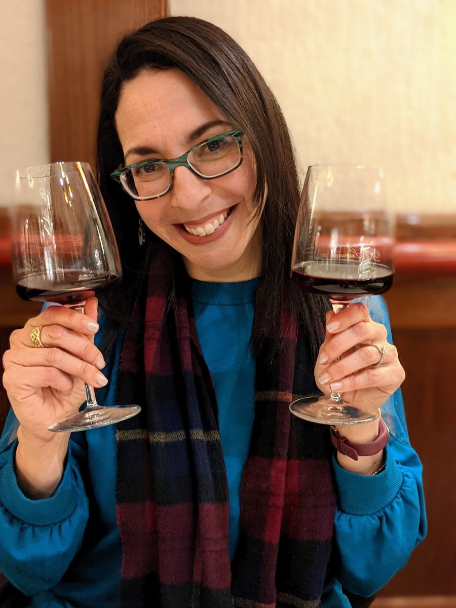 Teresa holding our wine glasses