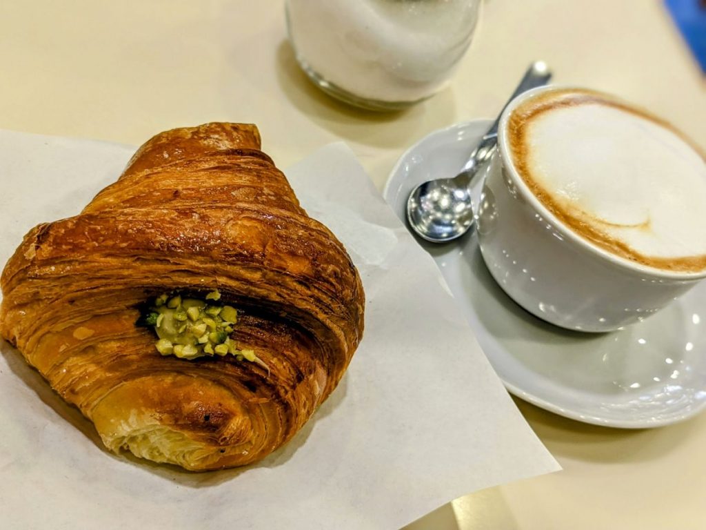 Cornetti con crema al pistacchio (pistacchio cornetto) and a cappuccino at Caffè Degl'Innocenti