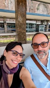 Teresa and I sitting on a bench at the train station, awaiting our train