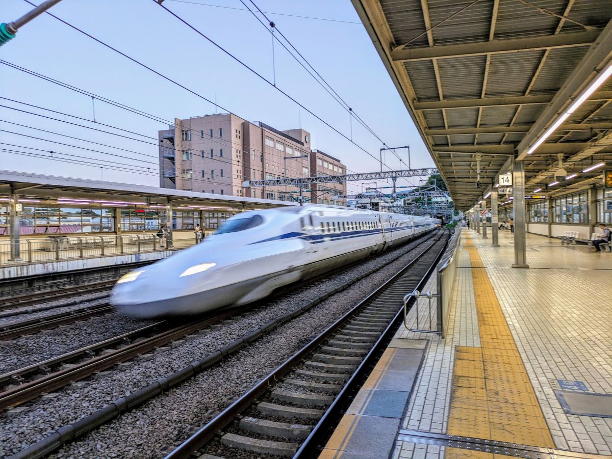 A Bullet Train speeding through the station