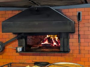 Photo of a wood fired pizza oven.
